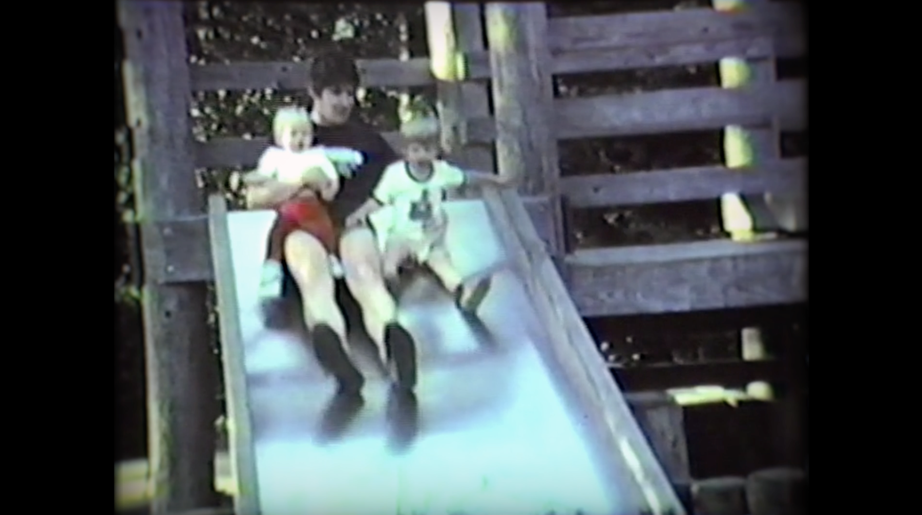 Vintage family footage of children on a slide, used as the VNS Health Private Pay video poster.